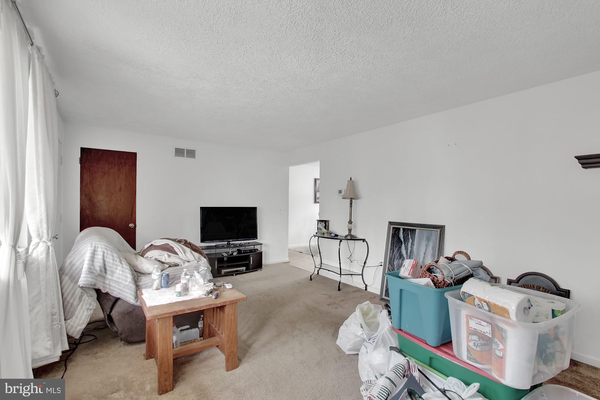 235 Dull Road Felton, PA 17322 - Photo 8 of 29 a living room with furniture and a flat screen tv
