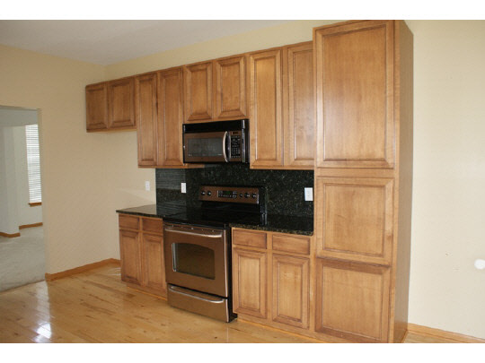 1446 Rock Island Road Davis Junction, IL 61020 - Photo 4 of 11 a kitchen with appliances cabinets and a counter top space