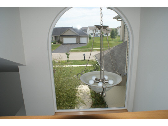 1446 Rock Island Road Davis Junction, IL 61020 - Photo 9 of 11 a picture of a floor to ceiling window and a kitchen