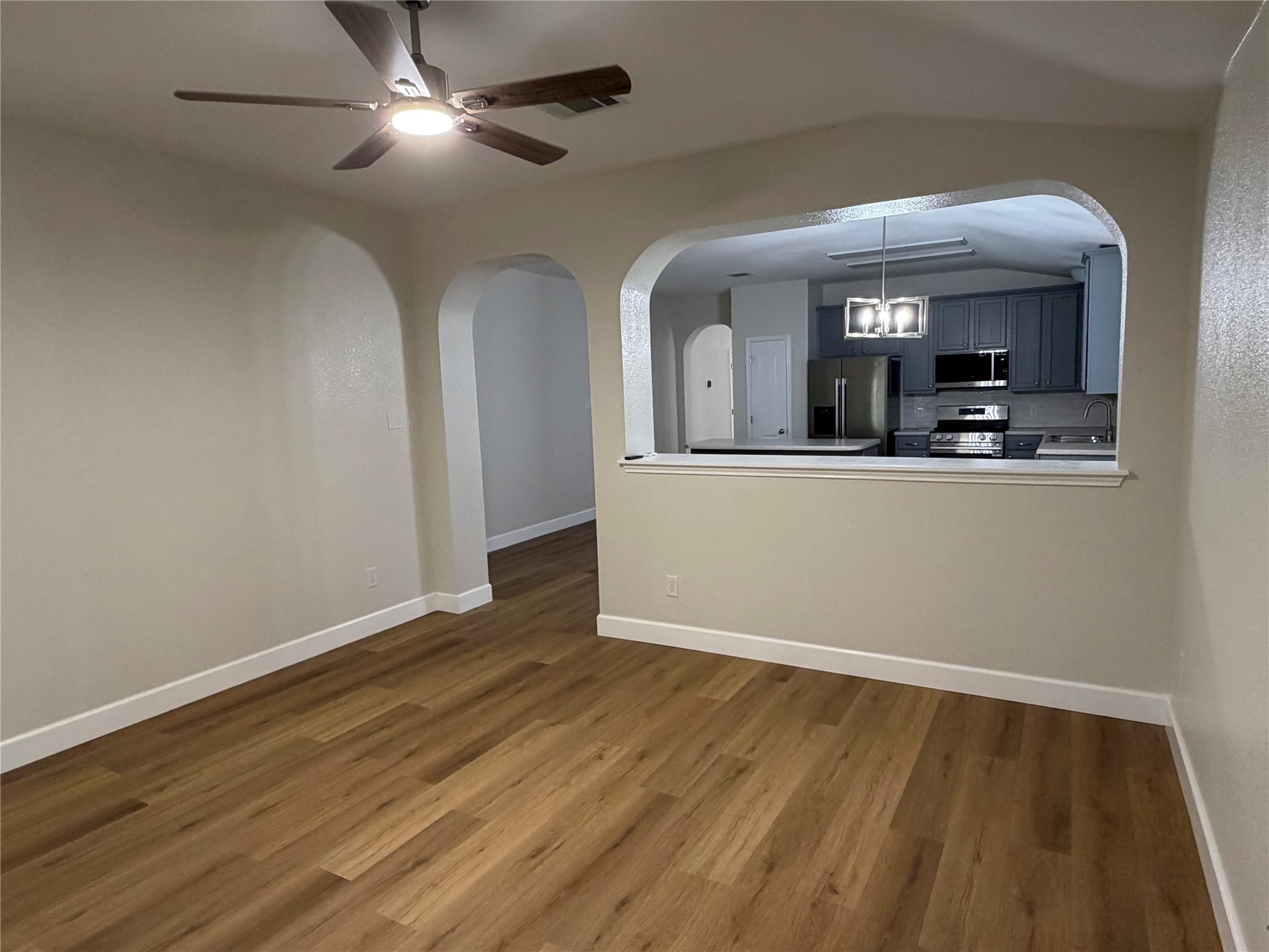 4604 Ramies Run Austin, TX 78749 - Photo 14 of 38 Arched pass-through cutouts connect the comfortable living room to the adjacent kitchen.