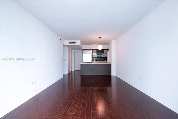 a view of kitchen with wooden floor