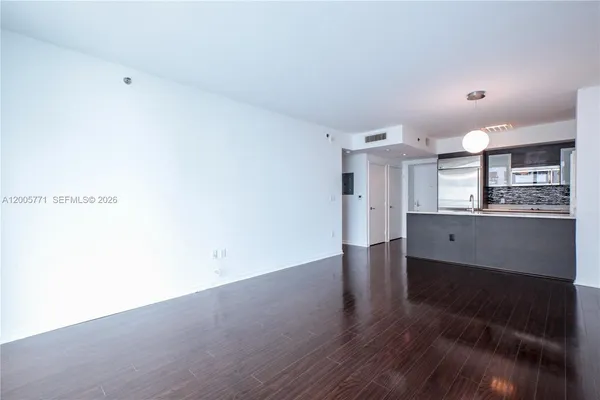 a view of kitchen with wooden floor