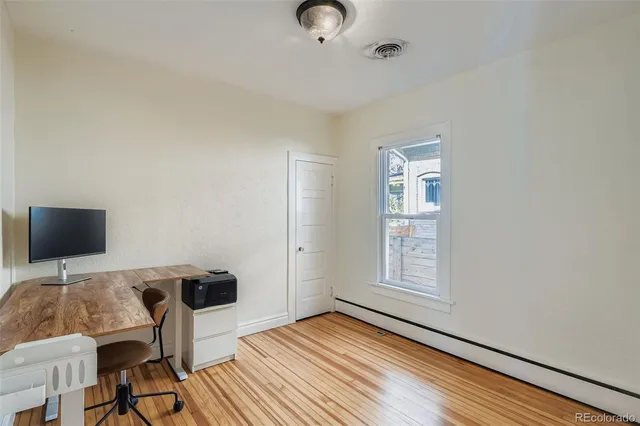 a workspace with furniture and window