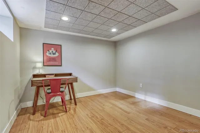 a room with a bench and a wooden floor