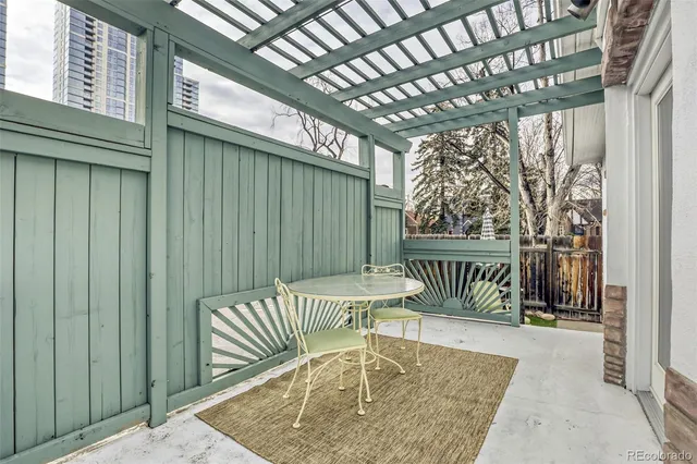 a view of a chair and tables in the balcony