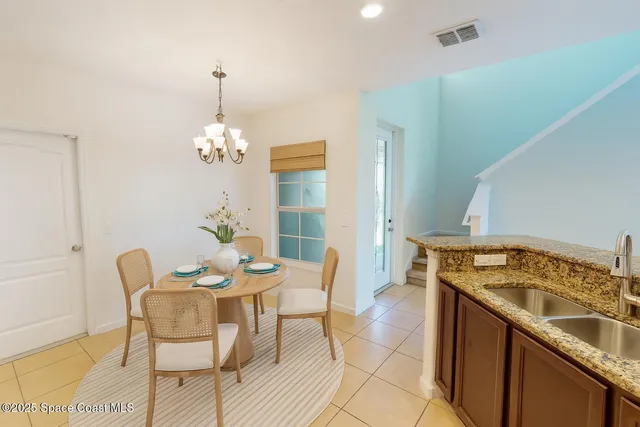 a dining hall with a dining table and chairs