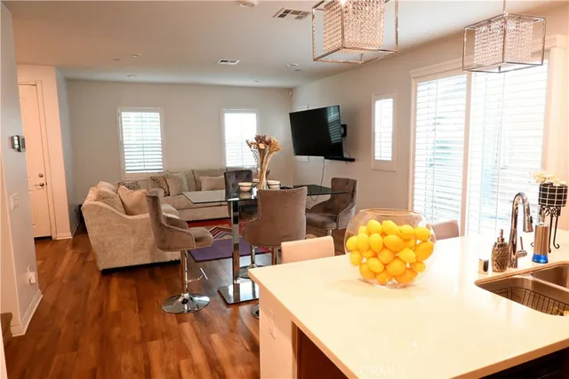 a living room with fireplace furniture and a flat screen tv
