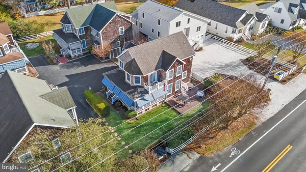 an aerial view of a house with a garden and swimming pool