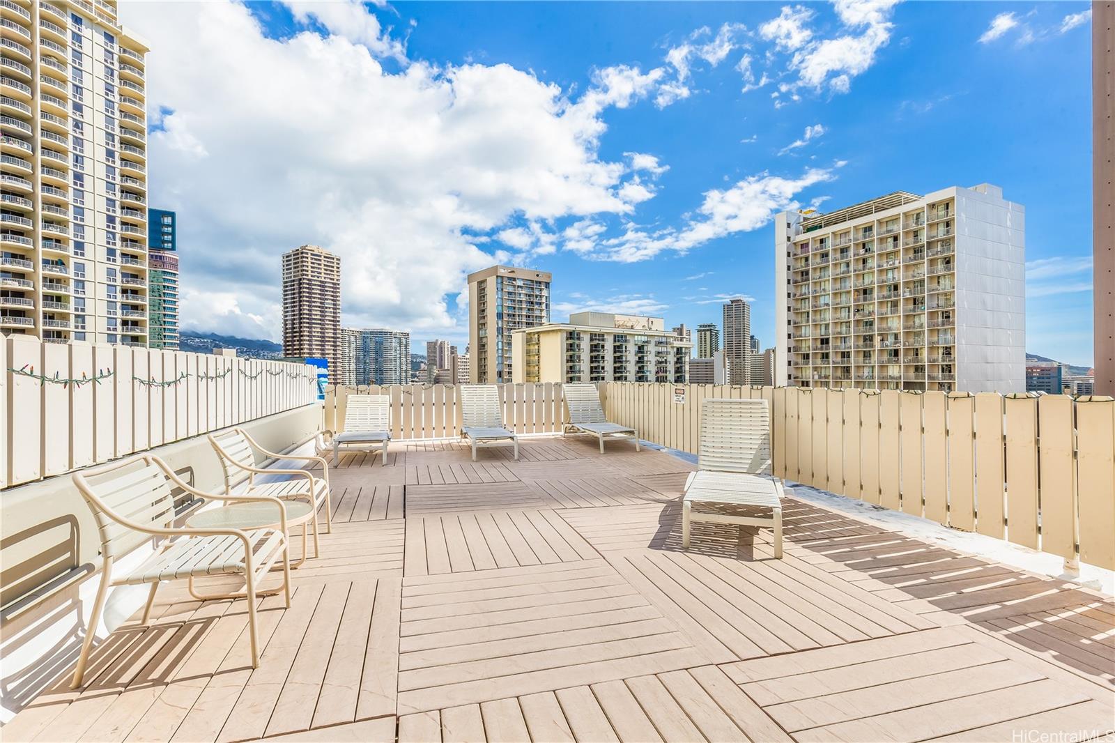 425 Ena Road, Unit 607C Honolulu, HI 96815 - Photo 15 of 21 a view of roof deck with city view and wooden floor