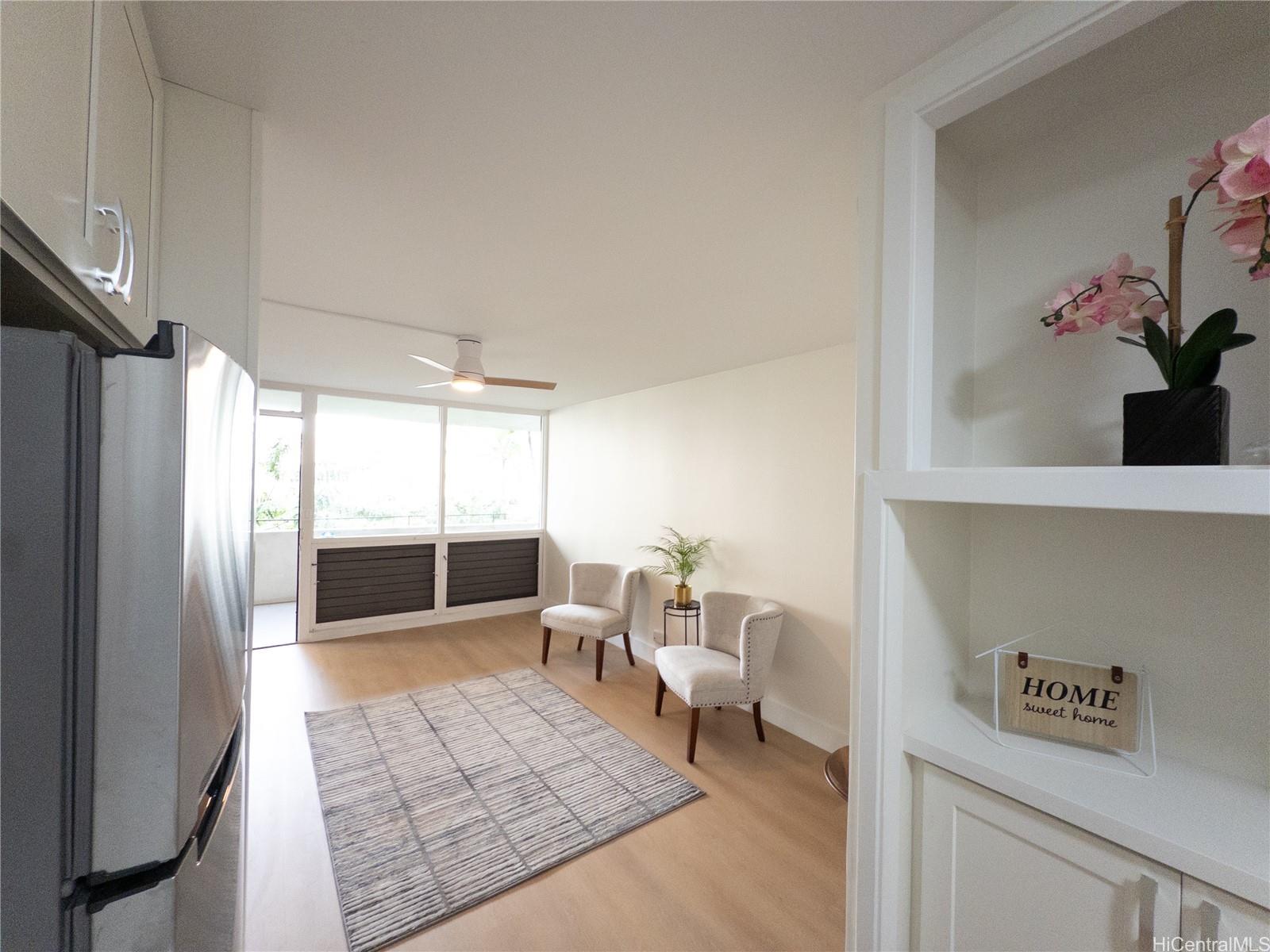 425 Ena Road, Unit 607C Honolulu, HI 96815 - Photo 3 of 21 a living room with furniture and a table