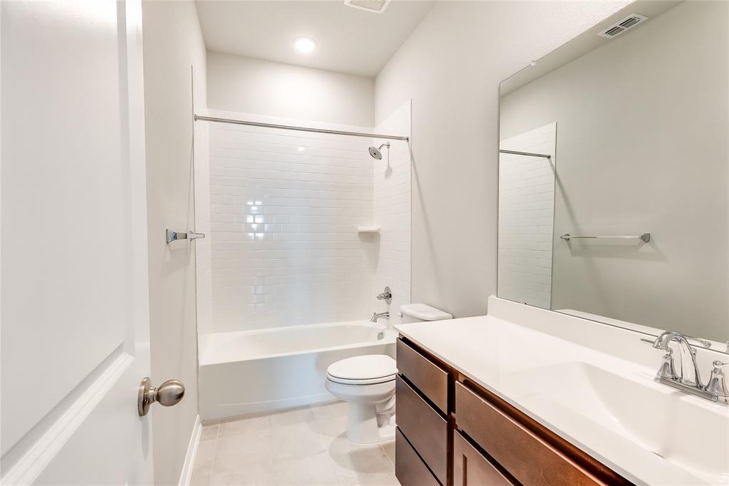 325 Diamondleaf Drive Buda, TX 78610 - Photo 19 of 29 a bathroom with a sink a toilet and shower