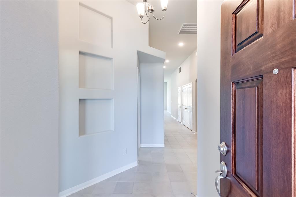 325 Diamondleaf Drive Buda, TX 78610 - Photo 4 of 29 a view of a hallway with interior of the house