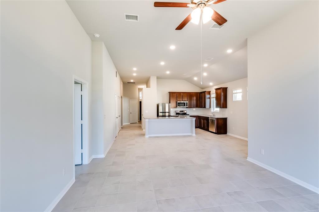 325 Diamondleaf Drive Buda, TX 78610 - Photo 28 of 29 a view of kitchen with refrigerator stove and microwave
