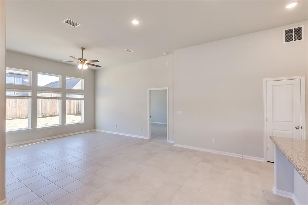325 Diamondleaf Drive Buda, TX 78610 - Photo 7 of 29 an empty room with windows and ceiling fan
