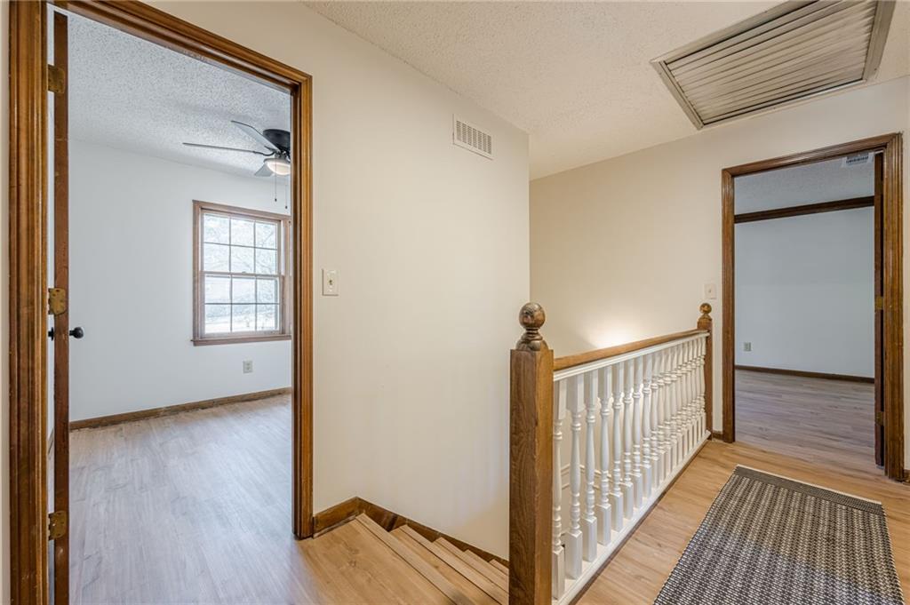 4147 Scofield Place Stone Mountain, GA 30083 - Photo 33 of 56 a view of a hallway with wooden floor and closet