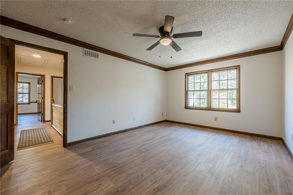 4147 Scofield Place Stone Mountain, GA 30083 - Photo 35 of 56 a view of a livingroom with a ceiling fan and window