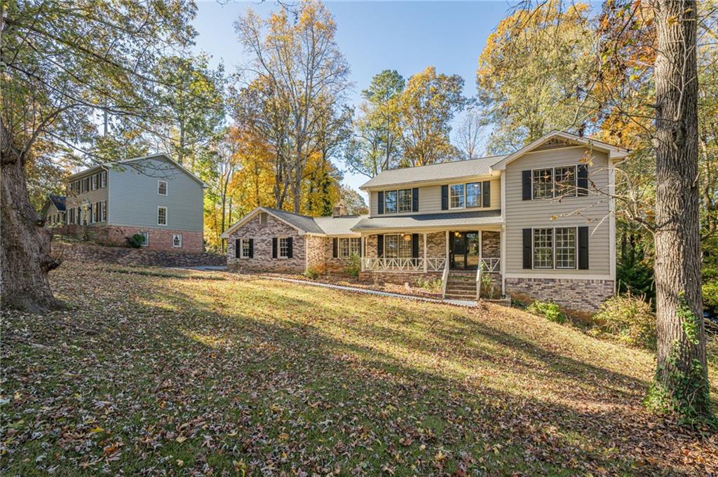 4147 Scofield Place Stone Mountain, GA 30083 - Photo 4 of 56 a front view of a house with a yard