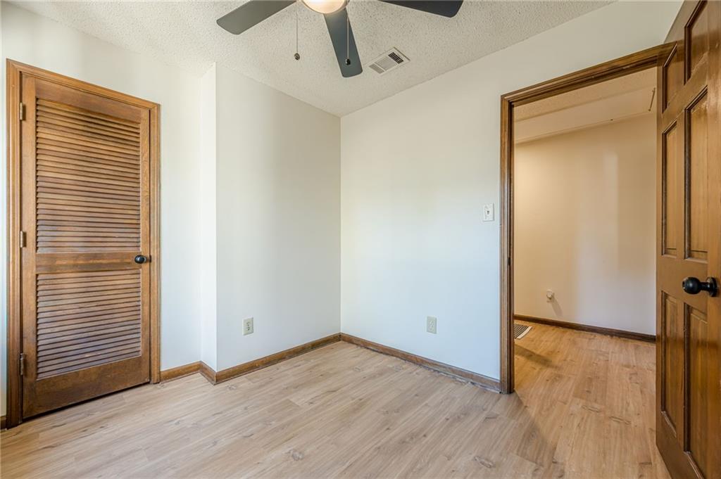 4147 Scofield Place Stone Mountain, GA 30083 - Photo 49 of 56 a view of empty room with wooden floor