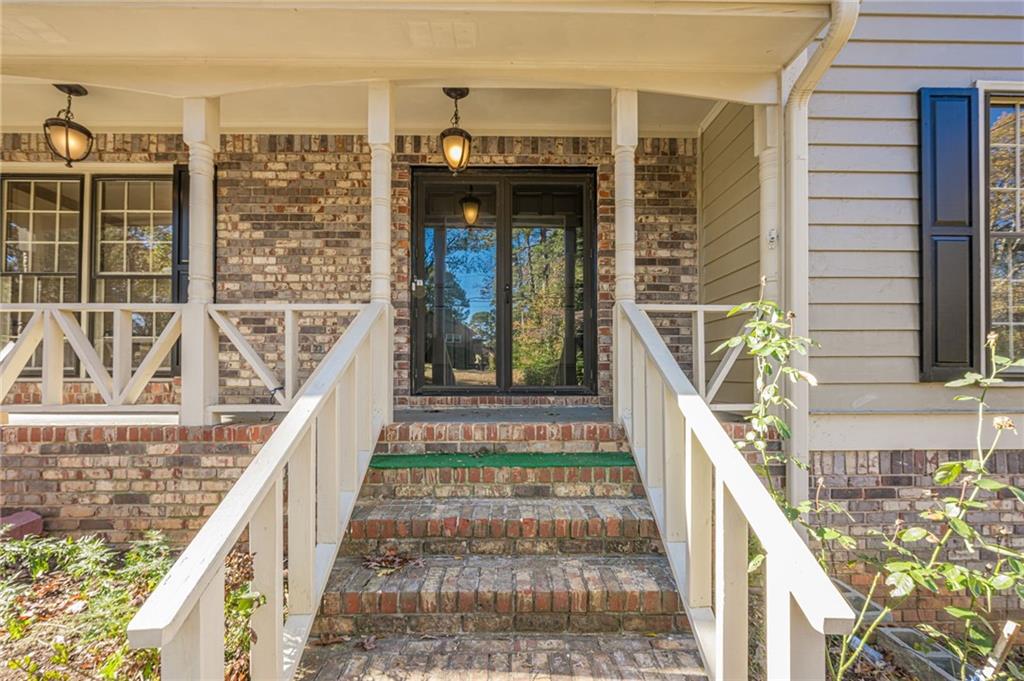 4147 Scofield Place Stone Mountain, GA 30083 - Photo 5 of 56 a view of balcony with large windows and wooden floor