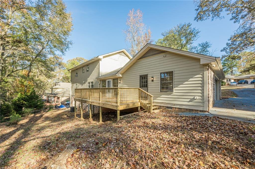 4147 Scofield Place Stone Mountain, GA 30083 - Photo 55 of 56 a view of a house with a yard and wooden fence