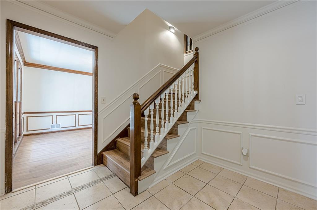 4147 Scofield Place Stone Mountain, GA 30083 - Photo 8 of 56 a view of a hallway with staircase