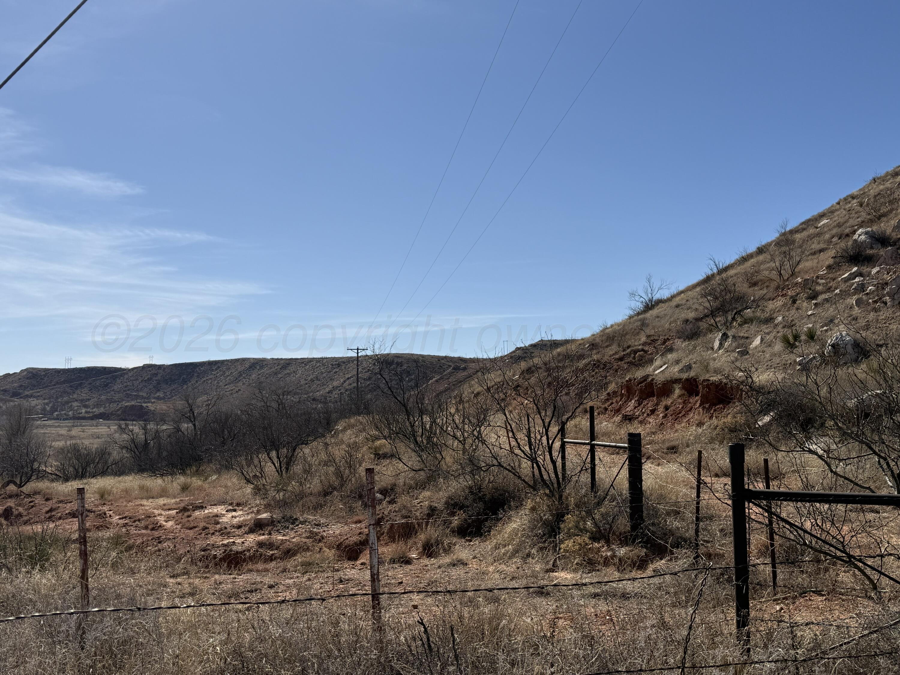 Petit Road Sanford, TX 79078 - Photo 2 of 14 a view of a dry yard with trees