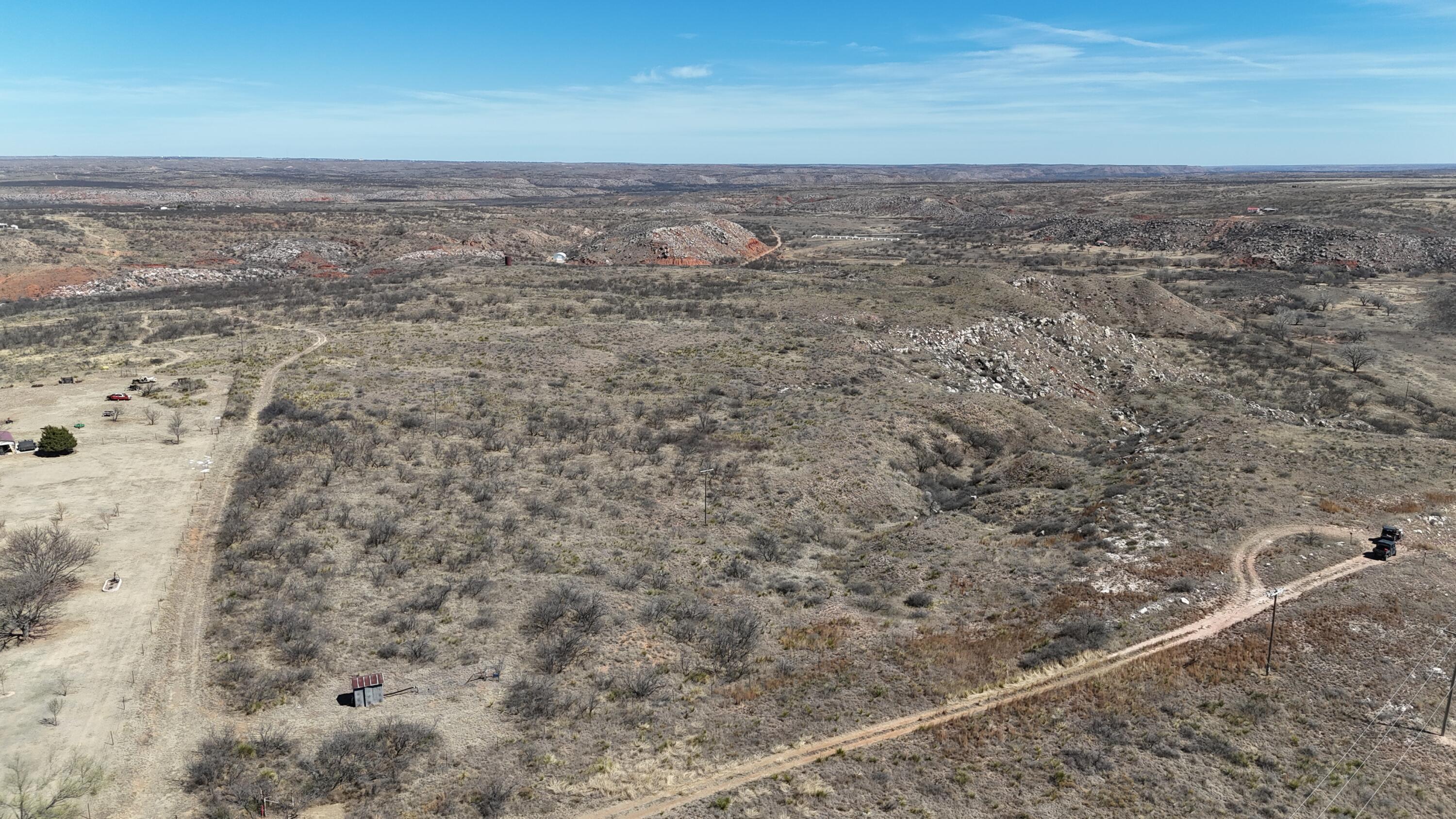 Petit Road Sanford, TX 79078 - Photo 10 of 14 a view of a dry yard with wooden floor