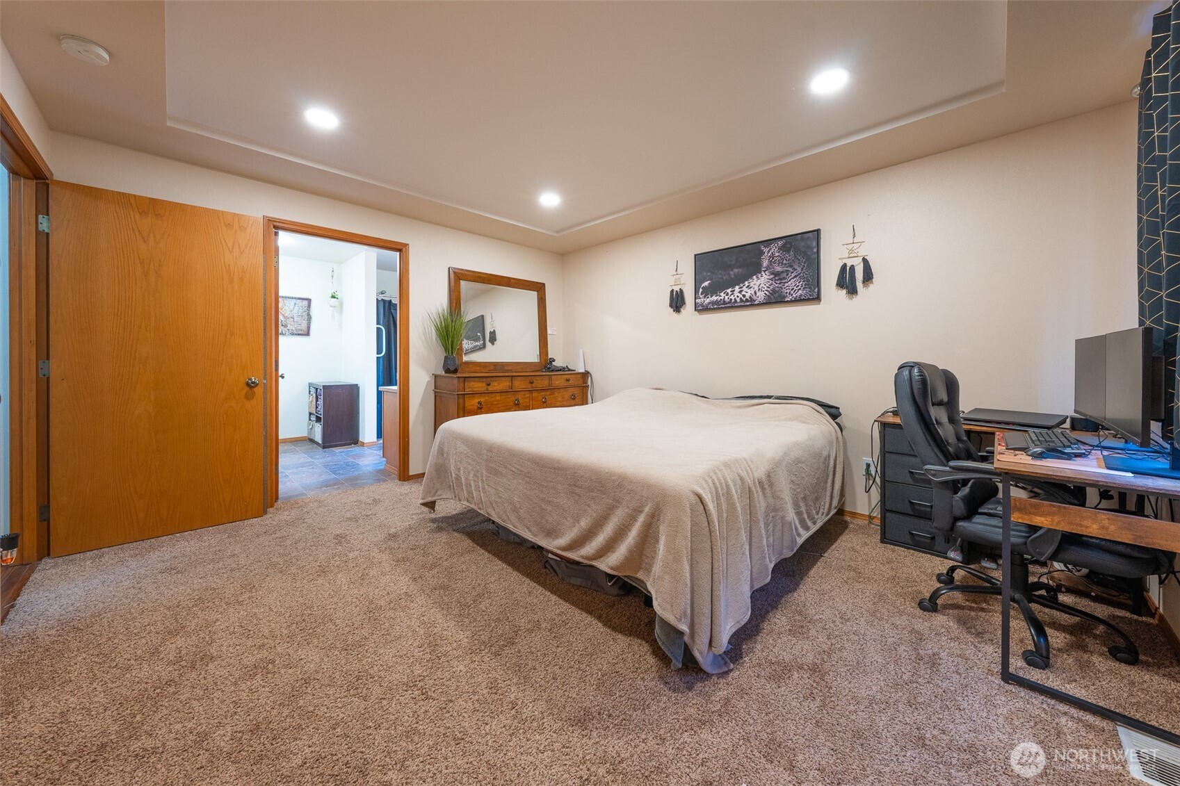 30608 40th Avenue East Graham, WA 98338 - Photo 11 of 30 a spacious bedroom with a bed and a desk in it