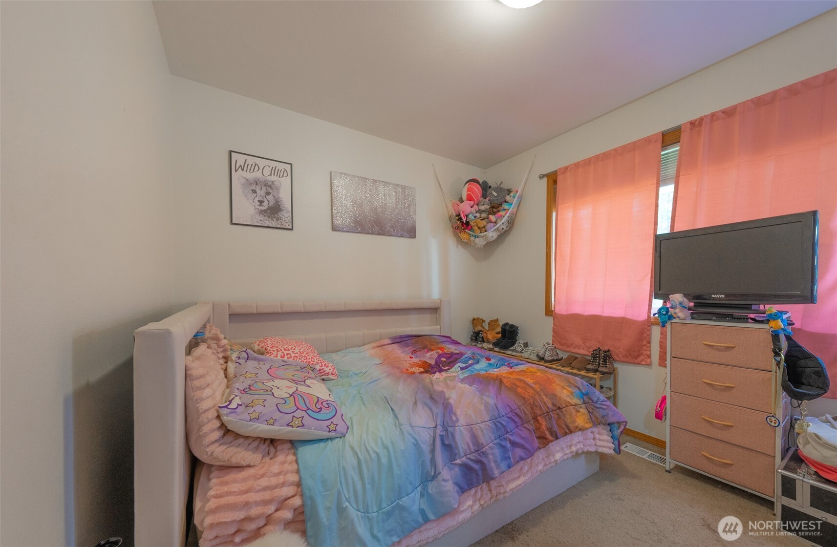 30608 40th Avenue East Graham, WA 98338 - Photo 15 of 30 a bedroom with a bed and a flat screen tv