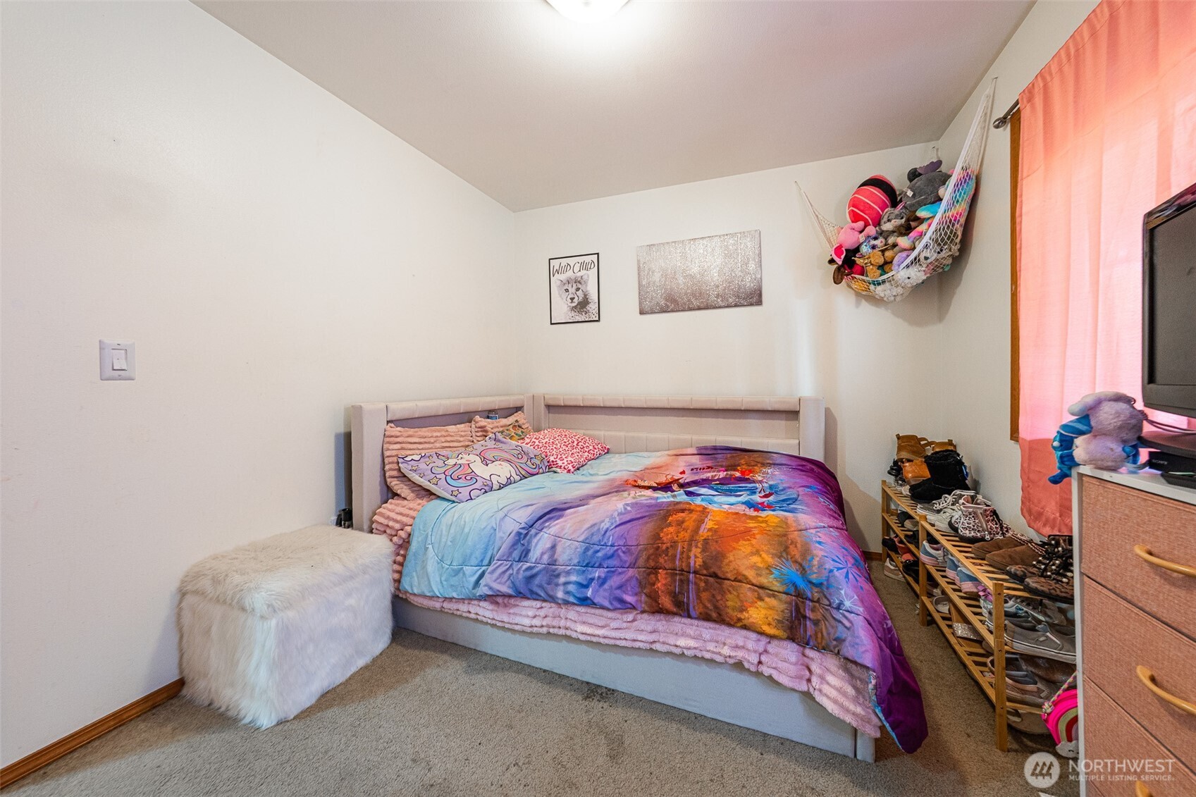 30608 40th Avenue East Graham, WA 98338 - Photo 16 of 30 a bedroom with a bed and a painting on the wall