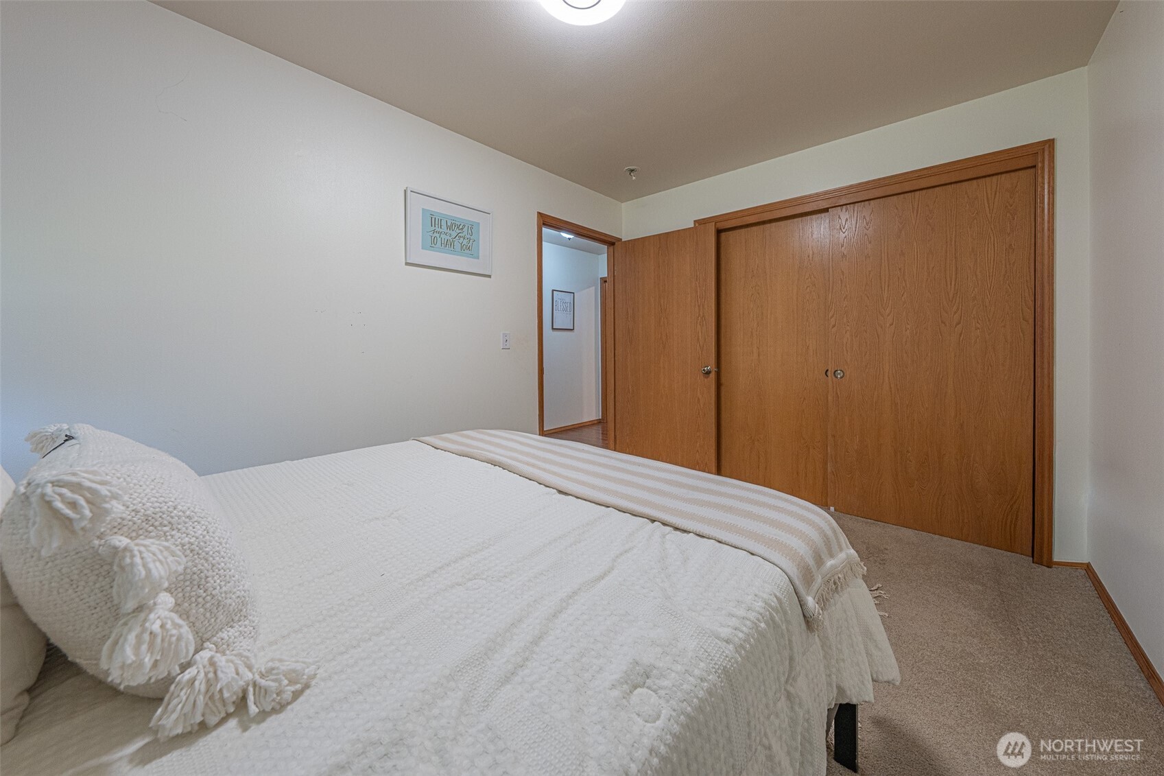 30608 40th Avenue East Graham, WA 98338 - Photo 19 of 30 a bedroom with a bed and a window