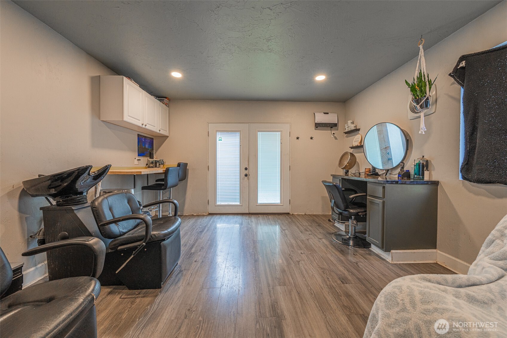 30608 40th Avenue East Graham, WA 98338 - Photo 21 of 30 a view of a workspace with furniture and a wooden floor