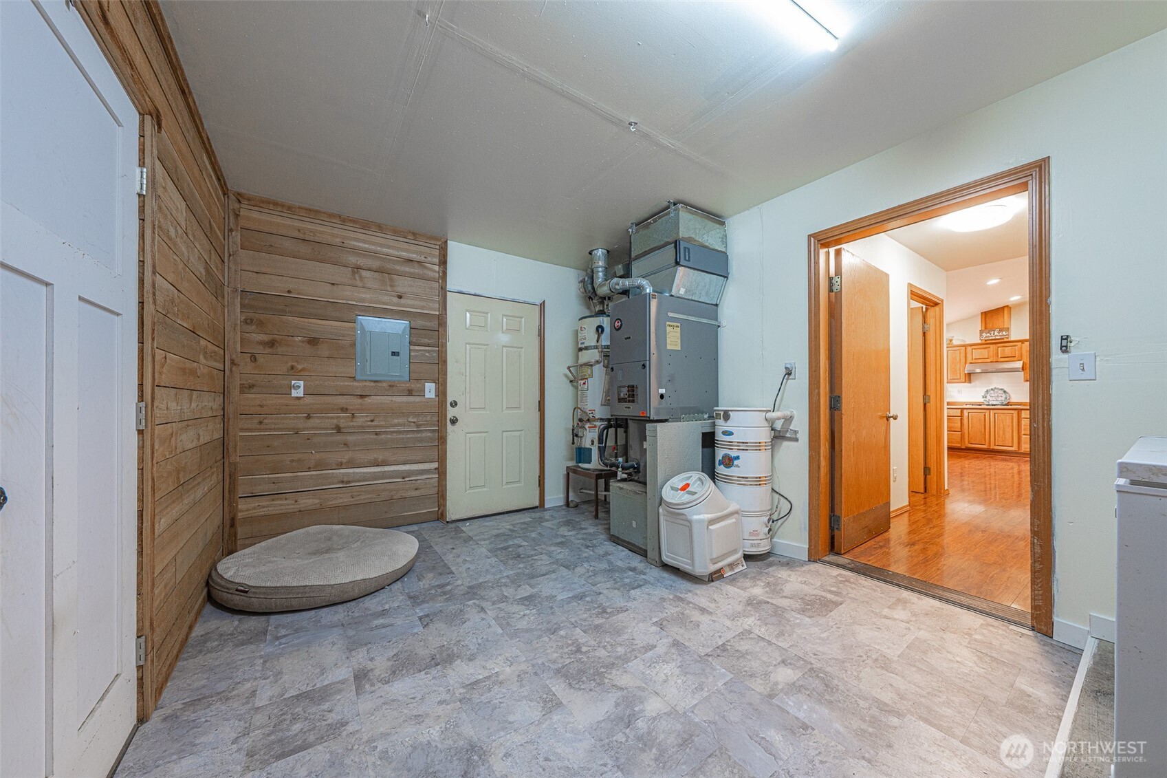 30608 40th Avenue East Graham, WA 98338 - Photo 24 of 30 a bathroom with a granite countertop toilet a mirror and shower