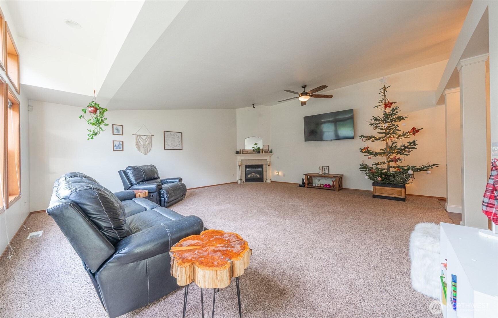 30608 40th Avenue East Graham, WA 98338 - Photo 6 of 30 a living room with furniture and a flat screen tv