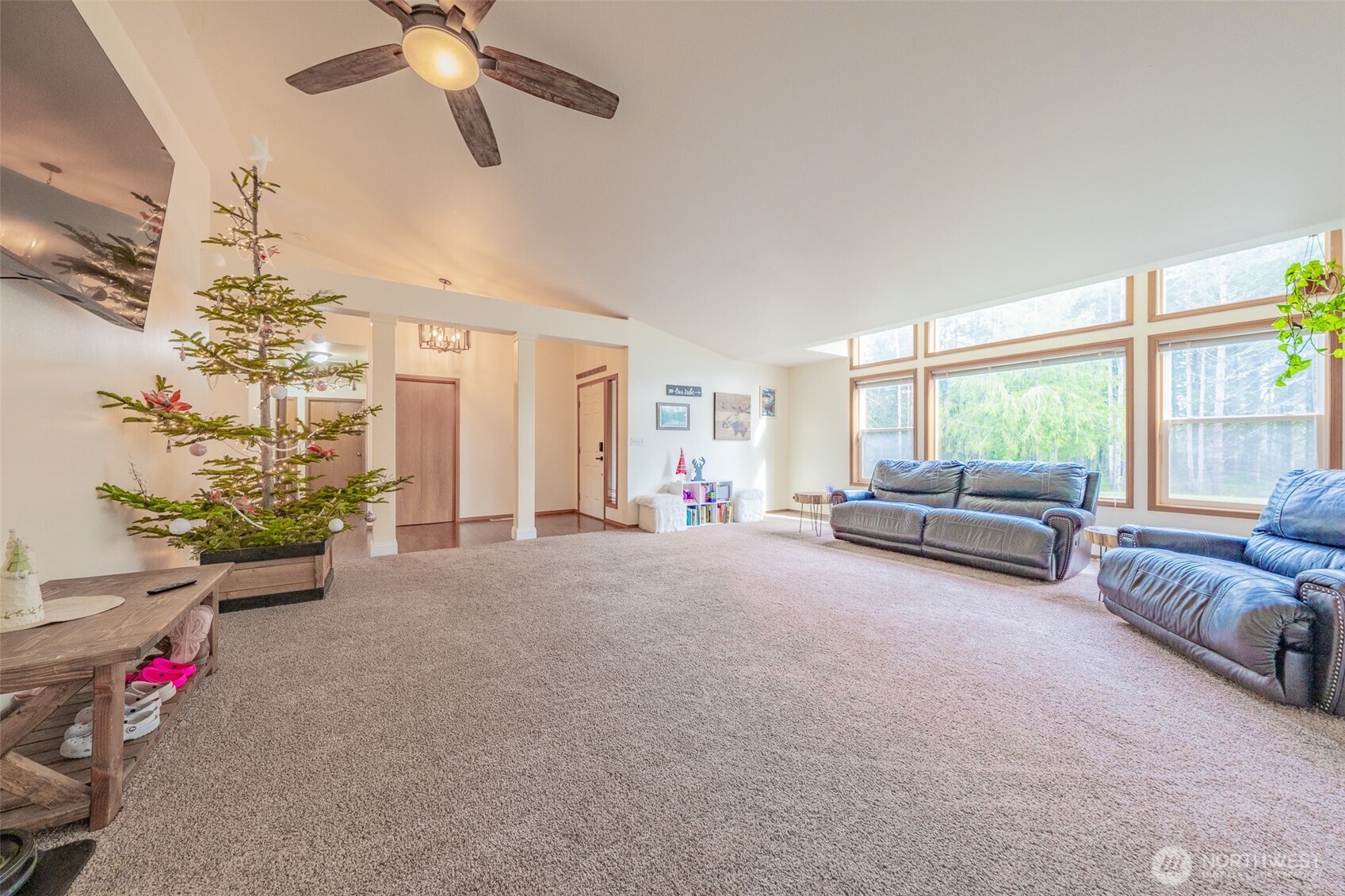 30608 40th Avenue East Graham, WA 98338 - Photo 7 of 30 a living room with furniture and a chandelier