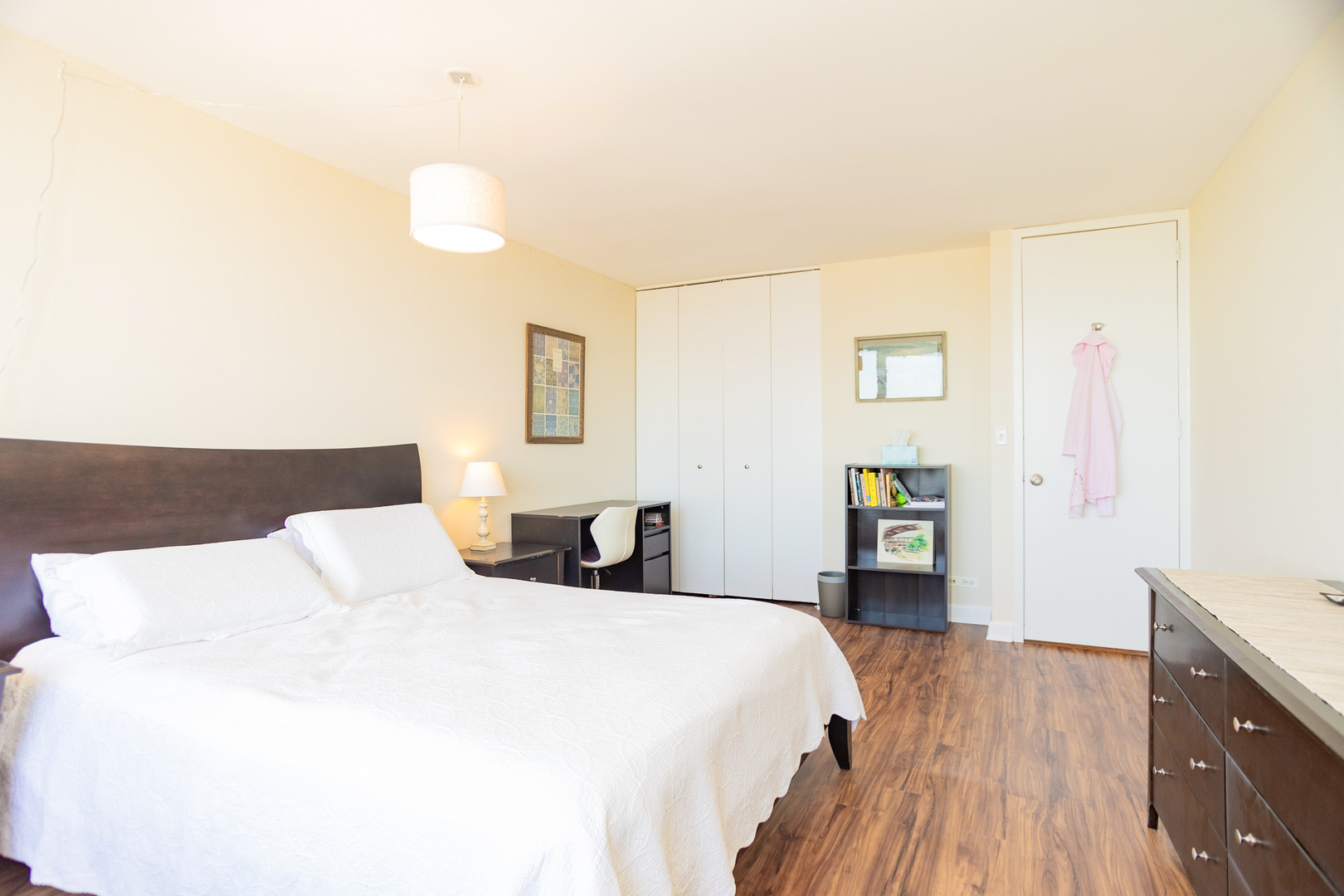 655 West Irving Park Road, Unit 3012 Chicago, IL 60613 - Photo 11 of 24 a bedroom with a bed and a dresser