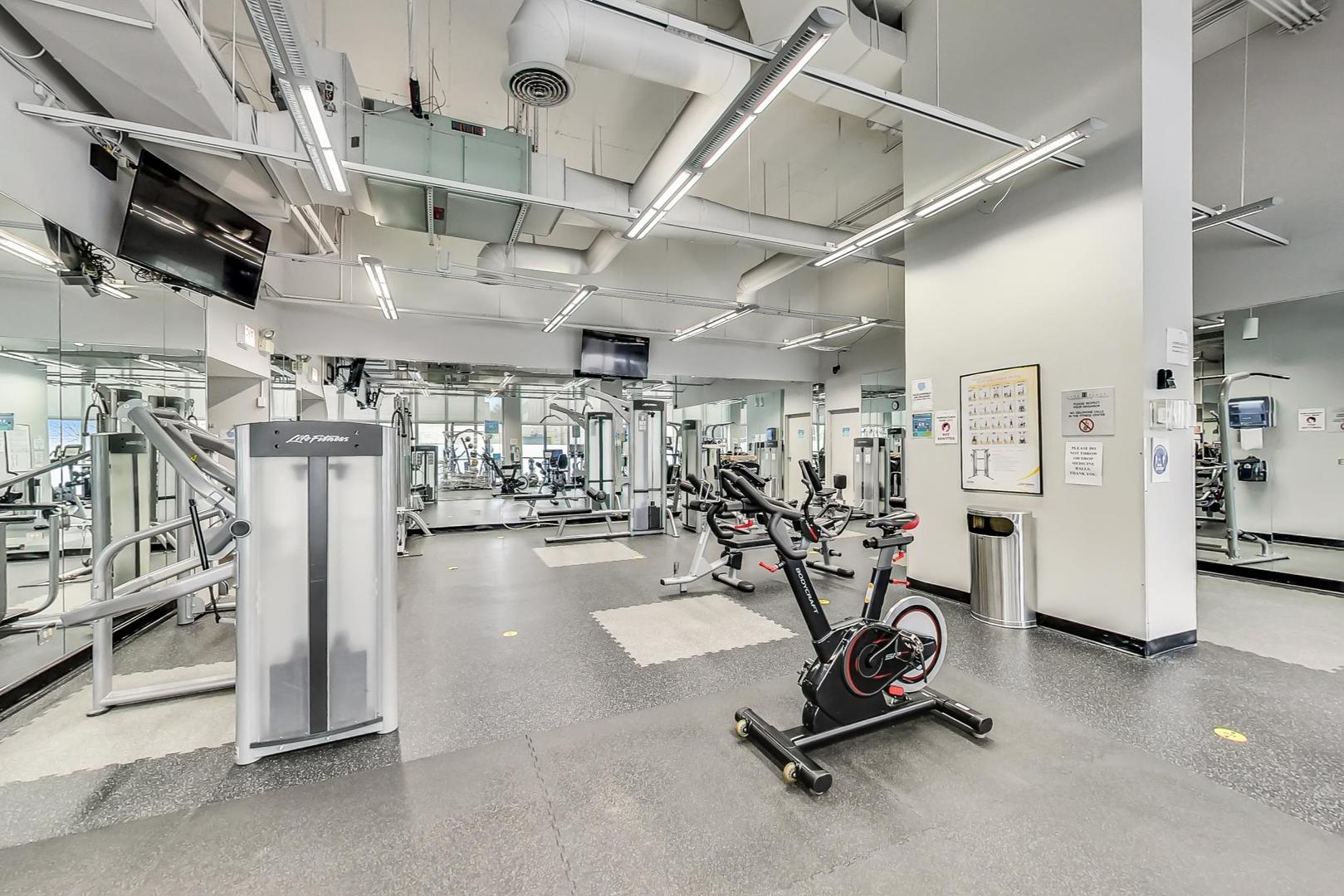 655 West Irving Park Road, Unit 3012 Chicago, IL 60613 - Photo 19 of 24 a view of a room with gym equipment