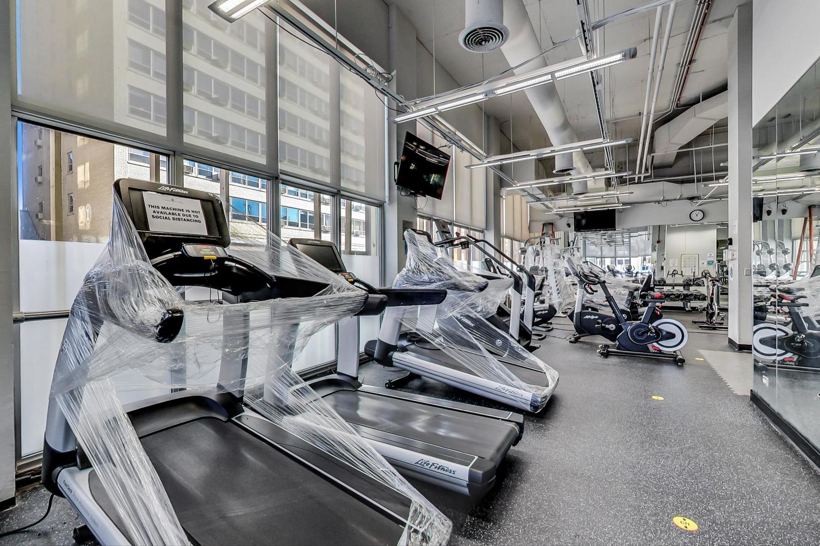 655 West Irving Park Road, Unit 3012 Chicago, IL 60613 - Photo 22 of 24 a view of a room with gym equipment