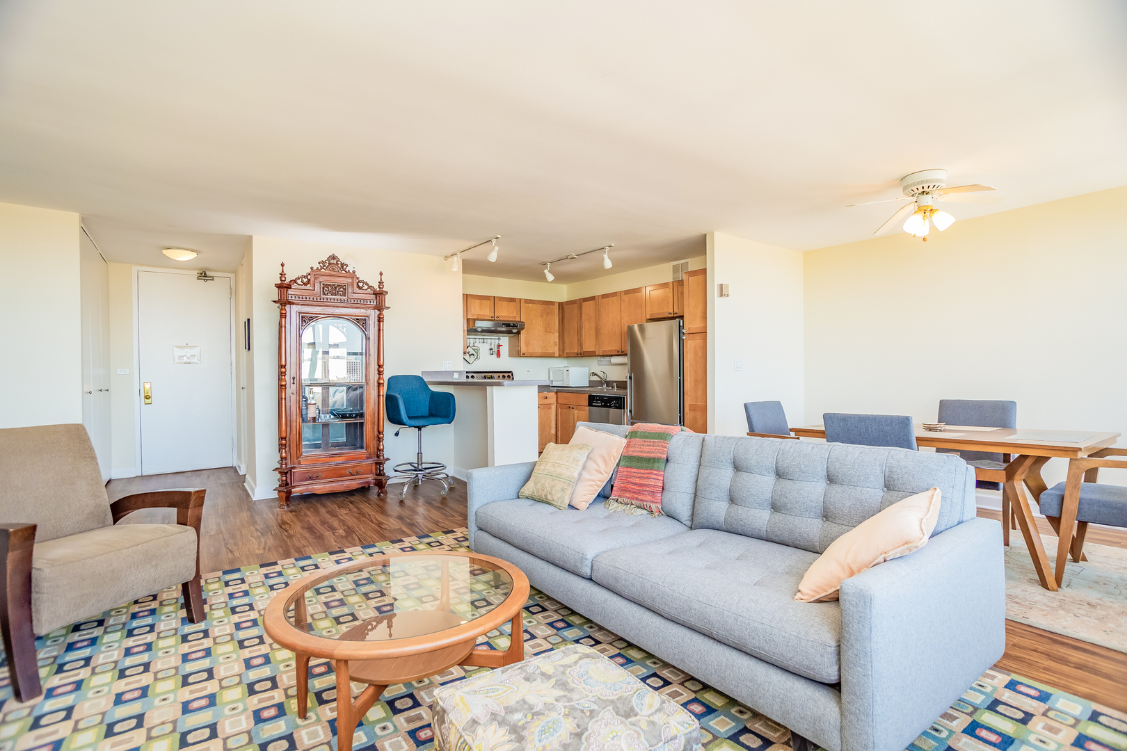 655 West Irving Park Road, Unit 3012 Chicago, IL 60613 - Photo 6 of 24 a living room with furniture and a dining table