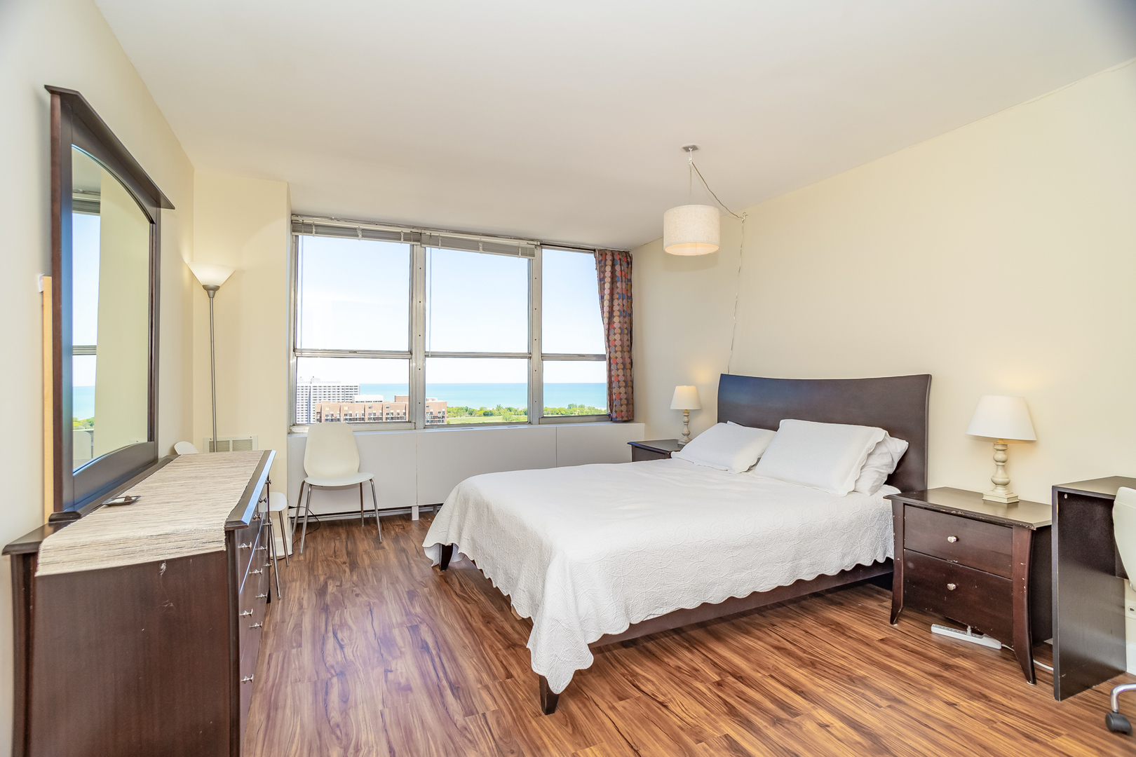 655 West Irving Park Road, Unit 3012 Chicago, IL 60613 - Photo 10 of 24 a bedroom with a bed and a large window