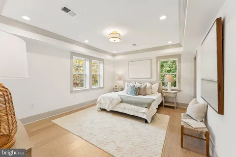 a spacious bedroom with a bed and a couch