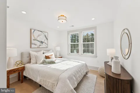 a bedroom with bed and a window