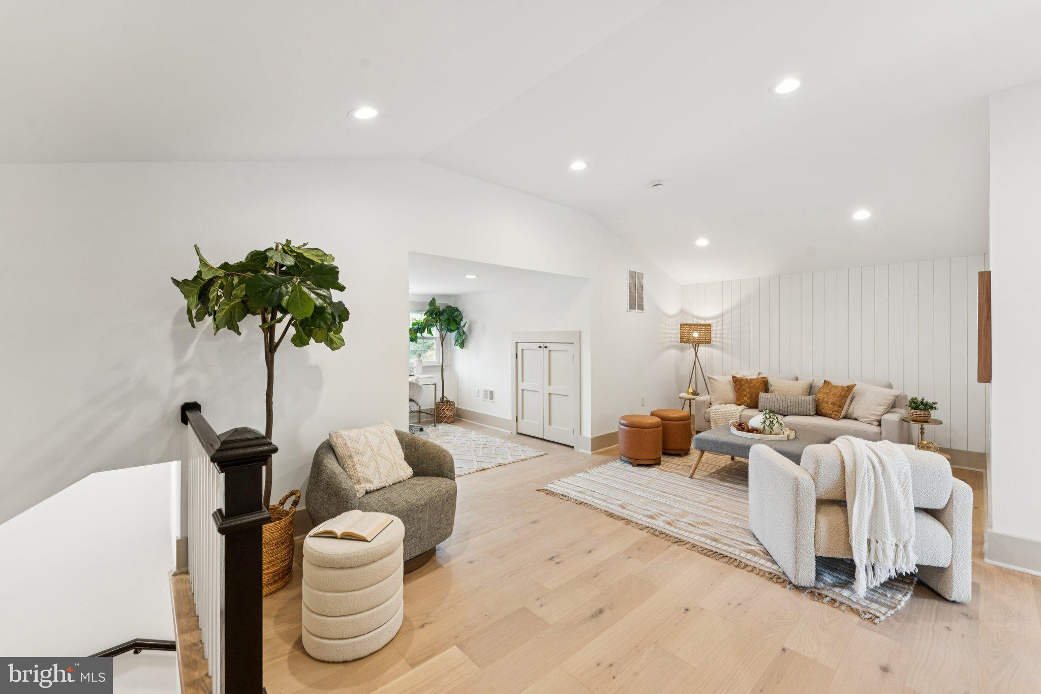 3216 Patterson Street Northwest Washington, DC 20015 - Photo 20 of 34 a living room with furniture and a potted plant
