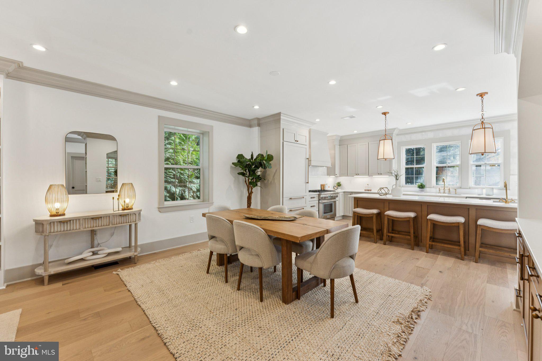3216 Patterson Street Northwest Washington, DC 20015 - Photo 5 of 34 a dining area with a table chairs and a kitchen view