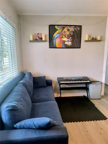 a living room with furniture and a rug
