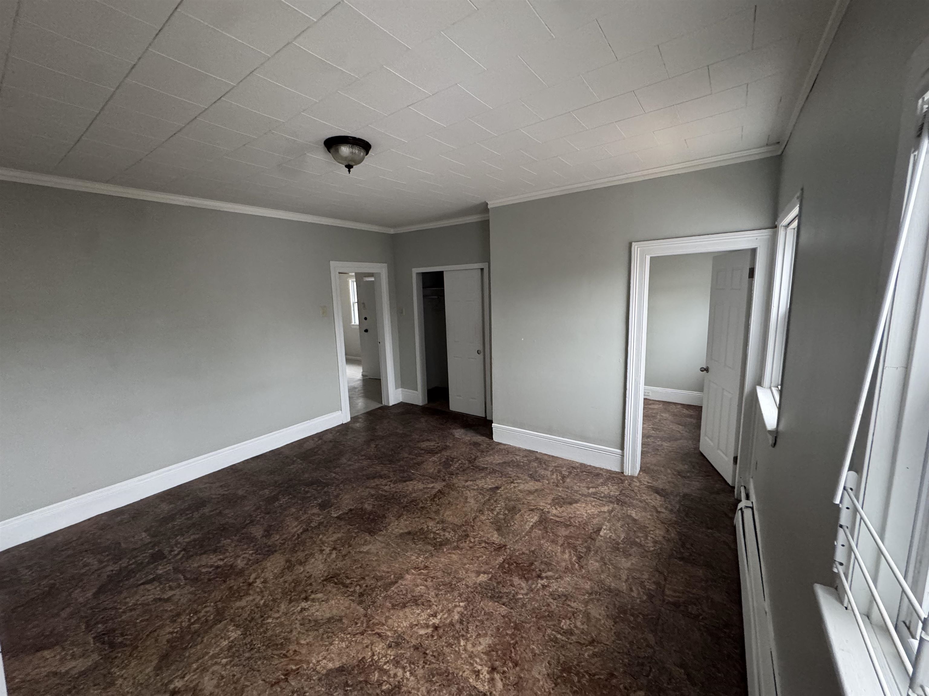 103 Prospect Avenue, Unit 2 Bayonne, NJ 07002 - Photo 6 of 12 a view of livingroom with hardwood floor and a ceiling fan