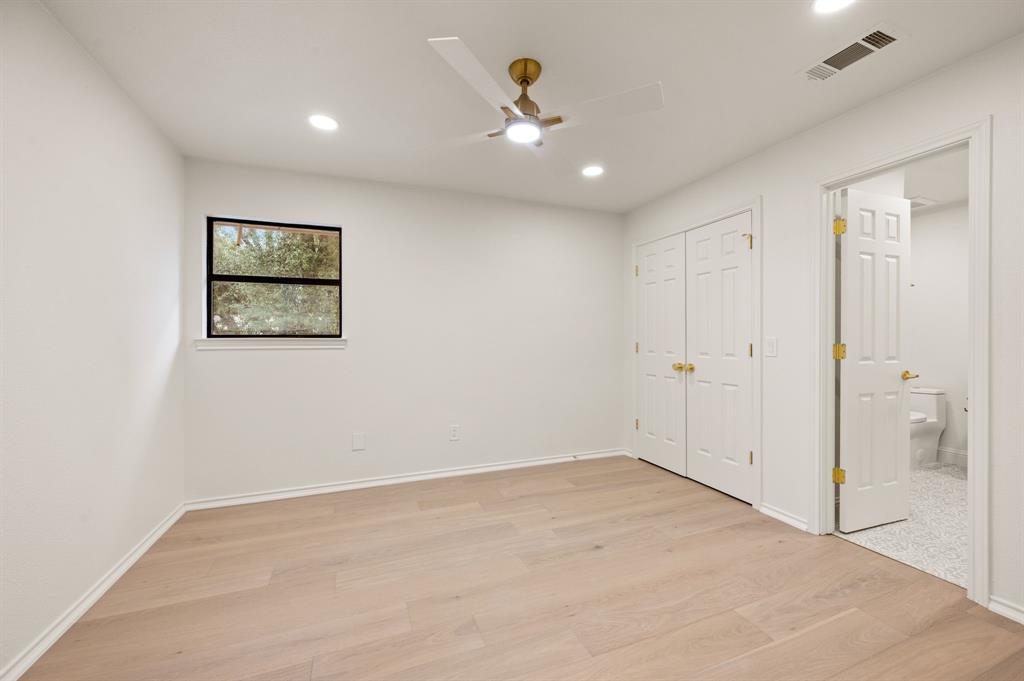 6403 Genstar Lane Dallas, TX 75252 - Photo 29 of 34 Room featuring wood-finish flooring, recessed lighting, and a modern ceiling fan with gold-tone hardware