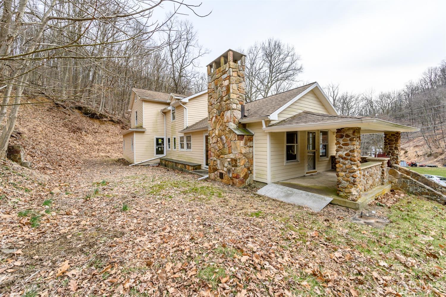 146 Millbrook Road Washington, NJ 07882 - Photo 23 of 25 front view of a house with a yard