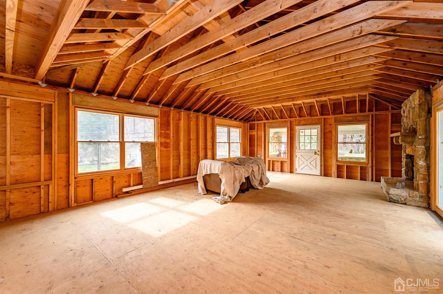 146 Millbrook Road Washington, NJ 07882 - Photo 7 of 25 a spacious bedroom with a large bed and large windows