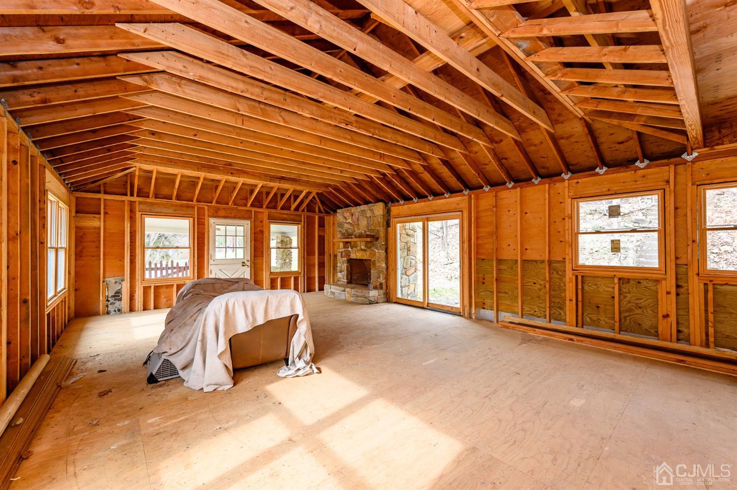 146 Millbrook Road Washington, NJ 07882 - Photo 8 of 25 a bed sitting in a spacious bedroom next to a window